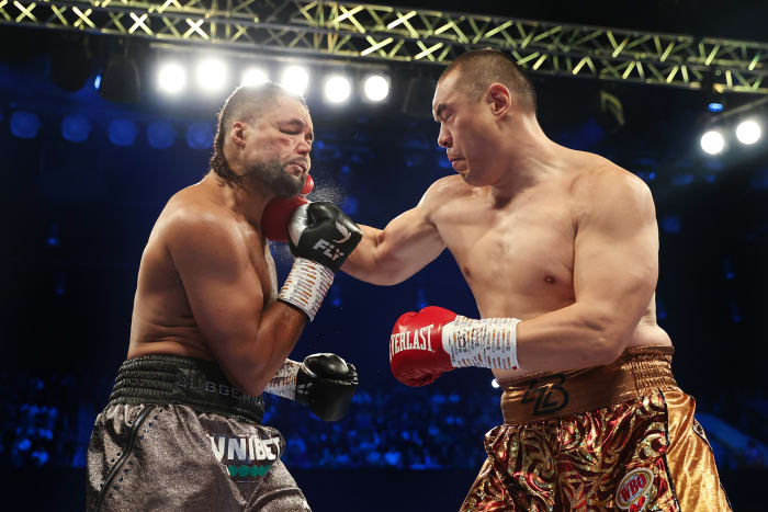 Zhilei Zhang punches Joe Joyce in a match in April of 2023.